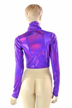 "This item is made to order, please read all the way through the listing before purchasing! Super shiny, sparkling holographic grape purple spandex. This crop top has a high turtle neckline and long sleeves, and a four way stretch fit. LENGTH: 8\" (from the underarm to the hemline) Womens Sizing (See below for instructions on where measurements should be taken) XXS: Bust 29\"-30\" / Waist 22\"-23\" / Hips 30\"-32\" Extra Small: Bust 31\"-32\" / Waist 24\"-25\" / Hips 33\"-35\" Small: Bust 33\"-3 Trendy Fitted Shiny Tops, Metallic Shiny Fitted Crop Top, Fitted Metallic Shiny Crop Top, Purple Winter Party Top, Purple Long Sleeve Stretch Crop Top, Purple Stretch Long Sleeve Crop Top, Metallic Fitted Long Sleeve Tops, Metallic Fitted Disco Crop Top, Fitted Iridescent Tops