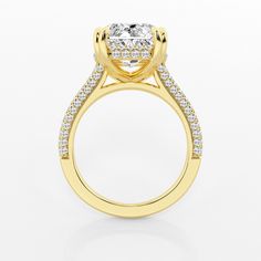 a yellow gold engagement ring with an oval cut diamond surrounded by pave set diamonds