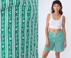 "Vintage 90s shorts in white and green with a striped floral print and an elastic waist. Please see measurements and condition below. Every garment we sell is authentic vintage! You will receive the exact item photographed. Condition: Very good vintage. Best fits women's: Labelled Small Tag: Blair Material:  Cotton Polyester blend MEASUREMENTS Taken from seam to seam while the garment is lying flat. Double the armpit, waist, and hips For reference, model is 5'9\" and measures 35-27.5-39. Waist: Vintage Green Bottoms For Summer, Retro Green Bottoms For Summer, Retro Green Summer Bottoms, Retro Green Summer Shorts, Green Retro Summer Bottoms, Retro Green Shorts For Spring, 90s Shorts, Shorts High Waisted, Floral Shorts