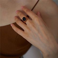 The Nightfall Ring is the perfect accessory for the modern woman who isn't afraid to embrace her dark side. With its sleek s925 sterling silver design and natural black agate stone, this ring exudes cool, edgy style that's perfect for any occasion. Whether you're out on the town or attending a formal event, the Nightfall Ring is sure to make a statement. Black Open Crystal Ring For Promise, Black Crystal Open Ring For Promise, Trendy Black Open Ring, Trendy Black Open Ring Jewelry, Modern Black Open Ring, Black Gemstone Open Ring, Black Open Ring With Gemstone, Elegant Black Crystal Open Ring, Black Agate Ring