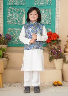 3 Piece Kurta Shalwar for Boys. Description Kurta (Shirt) : White Cotton Kurta with Buttons. Shalwar (Trouser) : White Cotton Shalwar. Waistcoat : Poly Viscose Printed Waistcoat. Country of Origin : Pakistan. General Care Instruction Should be washed in gentle cycle and hung to dry. Color may bleed so please be mindful of other items with it. General Disclaimer Size chart provides reference sizes and actual sizes might be slightly different from the size chart. Actual colors of the outfit may va Traditional Cotton Outerwear For Eid, Cotton Straight Kurta Set For Winter, Traditional Cotton Sherwani For Winter, Winter Cotton Straight Kurta Set, Eid White Kurta With Printed Border, Kurta Pajama With Vest, White Kurta For Boys, Pakistani Boys, Kurta And Pants