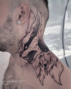 a man with a tattoo on his neck