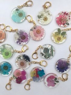 a bunch of flowers that are on some kind of keychain or bag charm