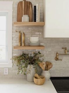 the kitchen counter is clean and ready to be used as a shelf for cooking utensils