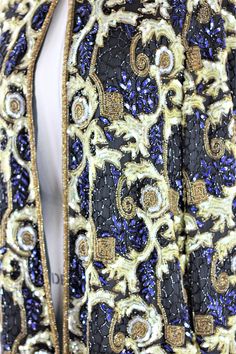 "With a Deep blue as the base, this long jacket is beautiful...in excellent condition...with an amazing pattern in gold..like a gold filligree...this is heavily embellished..and absolutely lovely!! Measuring: 30\" length Width: 46\" Sleeves: 23\" Pet Free/smoke free Enjoy!" Elegant Gold Outerwear With Sequins, Gold Embellished Outerwear For Formal Occasions, Traditional Gold Party Outerwear, Elegant Beaded Festive Outerwear, Festive Gold Evening Outerwear, Gold Embroidered Outerwear For Party, Gold Embroidered Party Outerwear, Festive Embellished Gold Outerwear, Festive Gold Embellished Outerwear