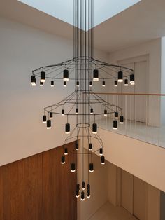 a chandelier hanging from the ceiling in a room