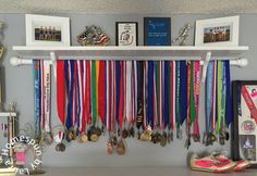 there are many medals hanging on the wall