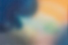 blurry photograph of an orange and blue object