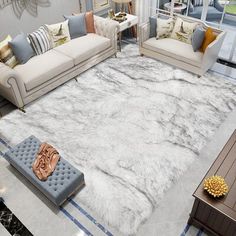 a living room filled with furniture and a large rug on top of a hard wood floor