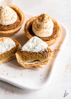 three mini pumpkin pies on a white plate with the words, rich creamy delicious easy mini pumpkin pies