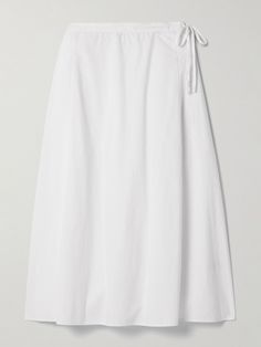 The Row's 'Fleur' skirt is as classic as it gets. Made from crisp cotton-poplin, it has a flattering A-line shape with a knotted tie detailing the left hip and sharp pleats along the back, ensuring it moves softly with your every step. Style it with a half-tucked sweater and ballet flats. Cotton Asymmetrical Skirt For Daywear, Elegant Cotton Wrap Skirt, Spring Cotton Midi Wrap Skirt, Classic Cotton Voluminous Skirt, Relaxed Cotton Midi Wrap Skirt, Classic Voluminous Cotton Skirt, Spring Pleated Cotton Wrap Skirt, Classic Cotton Gathered Skirt, Spring Cotton Pleated Wrap Skirt