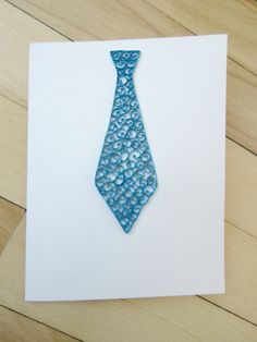 a card with a blue tie made out of water drops on the front and back