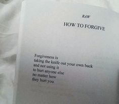 a close up of a book on a bed with white sheets and text that reads how to forget