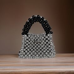 B&W wooden Beaded handbag. perfect for an evening out. all hand painted widen beads woven with 50lb line. fashionable design and large enough to carry your phone, wallet, keys and glasses!   This can be made in other colors and designs please DM me for special requests. Handmade Rectangular Trendy Evening Bag, Rectangular Bag With Black Beads As Fashion Accessory, Rectangular Black Beaded Bag For Gift, Rectangular Black Beaded Bag As Gift, Beaded Handbag, Phone Wallet, Bead Weaving, Other Colors, Dm Me