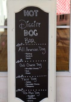 a chalkboard sign that says hot dog bar