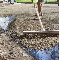 a man with a broom is cleaning the street