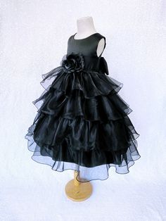 Beautiful organza ruffled dress tailor-made and ready to impress at any upscale event! Handcrafted with the upmost of care and attention to detail, we make sure that each dress is perfectly one of a kind for your little girl. Bridal satin top followed by a satin sash for a nice and snug fit Comes with a flower and matching colored sash. The skirt has layers of cut organza strips which are sewn onto the lining to create the ruffled effect The organza is then sewn at the edges to create those cris Infant Pageant, Organza Ruffle Dress, Pageant Photoshoot, Organza Flower Girl Dress, Photoshoot Birthday, Formal Chic, Flower Girl Wedding, Ruffle Gown, Dress Ruffles