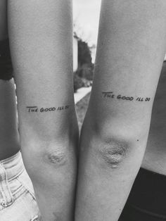 two people with tattoos on their arms that say, the good life and the bad lie