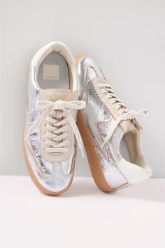 Elevate your look with the Notice Sneaker by Dolce Vita, featuring a low-top silhouette, metallic leather detailing, and a snake-embossed heel tab. Show them off with a midi dress or your favorite ankle jeans. | DOLCE VITA Women's Notice Sneakers, Size 7, Silver Backless Sneakers, Dolce Vita Sneakers, Bright Sneakers, Metallic Sneakers, Silver Sneakers, Colorful Shoes, Dolce Vita Shoes, Shoe Size Conversion, School Shoes