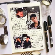 an open notebook with some pictures on it and other items around it including pens, scissors, tape, and paper