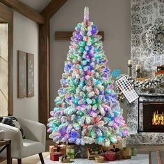 a brightly colored christmas tree in a living room