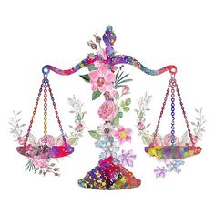 a scale that has flowers on it and two birds sitting on top of the scales