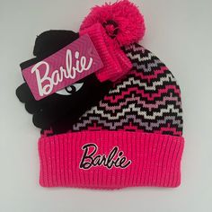 two beanies one with barbie and the other with barbie's name on it