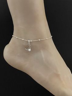 "Sterling Silver White Opal Moon Anklet Minimalist and Dainty Beaded Celtic Charm Anklet ANKLET FEATURES: Metal: All components are made from solid .925 Sterling Silver Model is wearing 10\" in length solid .925 Sterling Silver Bead Chain Chain Length: 9 inch + 1 inch extension Please send me a message if you have any questions before or after placing your order. Please also view my policy before purchasing. Please visit my storefront to view more of my creations: vonzjewel.etsy.com Thanks a lot Ankle Bracelets Silver, Beautiful Anklet Silverchain, One Leg Anklet Silver, Silver Metal Ankle Strap Anklet, Silver Adjustable Spiritual Anklets, Dainty Adjustable Nickel-free Anklets, Wedding Anklets, Beaded Ankle Bracelets, October Birthstone Jewelry