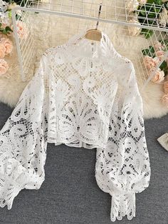 Upgrade your summer wardrobe with our Women Sexy Lace Hollow Out Short Blouse. The stunning lace and hollow-out design create a daring and alluring look that's perfect for a night out or any special occasion. The short length adds a touch of sexiness while the soft fabric ensures all-day comfort. Available in a range of colors to suit any style. Order now and turn heads everywhere you go this summer!Item Measurements(cm)One Size:Length:50 Sleeve:53 Bust:114 Waist:90Note:Measurements may exist 1- Lace Lanterns, Short Blouse, Stand Collar Shirt, Lantern Sleeved Blouses, Short Blouses, Elegant Blouses, Elegant Red, Loose Blouse, Looks Chic