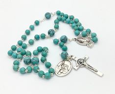 Gemstone Catholic 5 decade rosary made with 5mm turquoise beads,8mm gemstone beads on the place of Our father beads,miraculous medal centrepiece and st benedict crucifix. Give a gift of love and prayer with these wonderful rosaries. Hand made in Medjugorje. Feel free to contact me if you have any question. Thank you for stopping by! For more similar items and different colors visit our store: https://www.etsy.com/shop/Thelightjewelry?ref=seller-platform-mcnav Turquoise Rosary Bracelet With Round Beads, Turquoise Spiritual Rosary Bracelet With Round Beads, Spiritual Turquoise Rosary Bracelet With Round Beads, Turquoise Rosary With Round Beads, Spiritual Turquoise Rosary With Round Beads, Turquoise Rosary With Round Beads As Gift, Guadalupe Bracelet, St Benedict Bracelet, St Benedict Cross