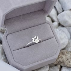 An adorable yet classic sterling silver engravable paw print ring that symbolizes unconditional love for your dog, cat and/or loyal companion. It is a lovely way to symbolize how much you like your pet. Celebrate the everlasting bond you share by treating yourself with this paws-itively perfect piece. Ideal for the obsessed animal lover, this paw print ring with initial is the purr-fect gift for a loved one or a beautiful piece of art that compliments your unique and individual style. It may be Dogs Paw Print, Dogs Paw, Paw Print Ring, Dog Paw Print, Initial Ring, Dog Paws, Unconditional Love, Stackable Rings, 18k Rose Gold