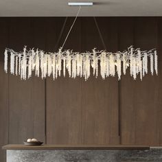 a modern chandelier hanging from the ceiling