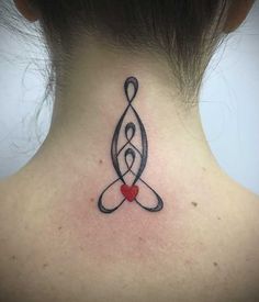 a woman's neck with a tattoo on the back of her neck and a red heart