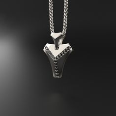 This magnificent pendant is composed of 18k white gold, includes 16 black diamonds and is completely handmade. A talisman stone is for those who want to know what life is all about. It will bring out all of your great qualities. The vertebrae that make up the human spine influenced its design. On a psychological level, this diamond represents what gives man the fortitude, bravery, drive, and unwavering belief to achieve his goals.Many people like white gold because of its silvery white hue, which gives it a refined appearance while also making it considerably more expensive than silver.White gold is impervious to rust, tarnish, and corrosion. White gold is more durable than yellow gold because it is alloyed with a combination of harder metals. Made entirely by hand with all the love and ar Luxury Black Diamond Pendant Necklace, White Gold Necklace With Black Diamonds For Gift, Sterling Silver Black Diamond Pendant Necklace, Sterling Silver Pendant Necklace With Black Diamonds, Minimalist Sterling Silver Jewelry With Black Diamonds, Black Diamond Pendant Jewelry Gift, Modern Sterling Silver Jewelry With Black Diamonds, Luxury Silver Jewelry With Black Diamonds, Luxury White Gold Jewelry With Black Spinel