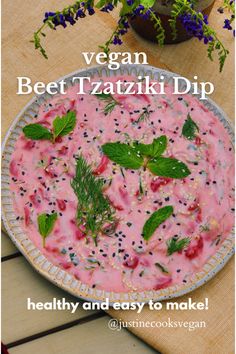 an image of a bowl of food on a table with flowers and herbs in the background