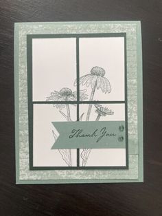 a card with flowers on it and the words thank you written in front of them