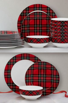 red and black plaid dinnerware with white dishes on the shelf next to each other