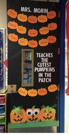 a classroom door decorated with pumpkins and words