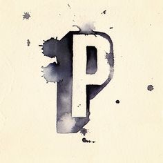 the letter p is painted in black and white with watercolors on it's paper