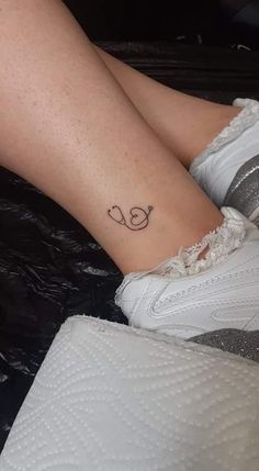 a woman's foot with a tattoo on it that says i love you in cursive letters