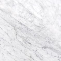 a white marble textured surface that looks like it could be used as a background