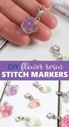 the diy flower resin stitch markers are being held by someone's hand