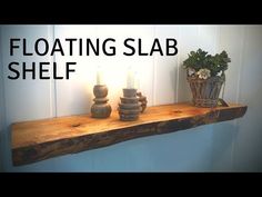 floating slab shelf with candles on top