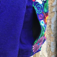 Inspired by the beauty of Mexico this vivid, coloring bursting embroidery jacket is a real eye-catcher. The fabric was made from scratch using a loom, thread by thread. 100% cotton. Partially Lined with Fleece so it’s a very warm piece, has one interior secret pocket and 2 pockets at the front also lined with fleece. MADE IN MEXICO By: Mexican Artisans For: Women Size: X-Large (view size chart) Color: blue | multi Details: 100% cotton Embroidery Toggle button closure Shoulder pads 2 front pocket Blue Folk Embroidered Outerwear, Blue Folk Style Embroidered Outerwear, Blue Embroidered Cotton Outerwear, Blue Cotton Outerwear With Floral Embroidery, Folk Style Cotton Outerwear With Geometric Embroidery, Embroidery Jacket, Secret Pocket, Toggle Button, Made From Scratch