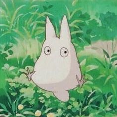 an animated image of a rabbit in the grass with eyes wide open and one hand on his hip