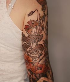 a woman's arm with flowers on it