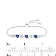 Wrap your wrist in elegant and romantic style with this heart-shaped blue and white lab-created sapphire infinity bolo bracelet. Fashioned in sterling silver Looped infinity-style links shimmer with white lab-created sapphire-lined and polished ribbons. Three 5.0mm heart-shaped bright blue lab-created sapphires add a pop of color and sweet detail. This wheat chain bracelet adjusts up to 9.0 inches in length and secures with a bolo clasp and ball ends. Bolo Bracelet, White Lab, Bracelet Clasps, Sapphire Stone, Romantic Style, Blue Heart, Stone Settings, Bright Blue, Sterling Silver Bracelets