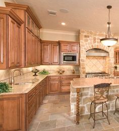 a large kitchen with an island in the middle