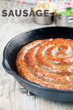 a pan filled with food sitting on top of a wooden table