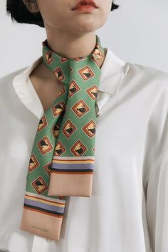 Kiwi silk twill neck bow skinny scarf is named after the open landscape and island views of New Zealand. Let the colors take you on an adventure. Three color options: Lilac Blue, Green, and Orange. 100% silk twill. Style as a necktie, an accessory to a top, a vest framing a top or jacket, a headband, a bag accessory, or a bracelet. Inner Freedom, Open Landscape, Bow Scarf, Silk Neck Scarf, Lilac Blue, Side Stitch, Neck Bow, Hand Drawn Pattern, Twilly